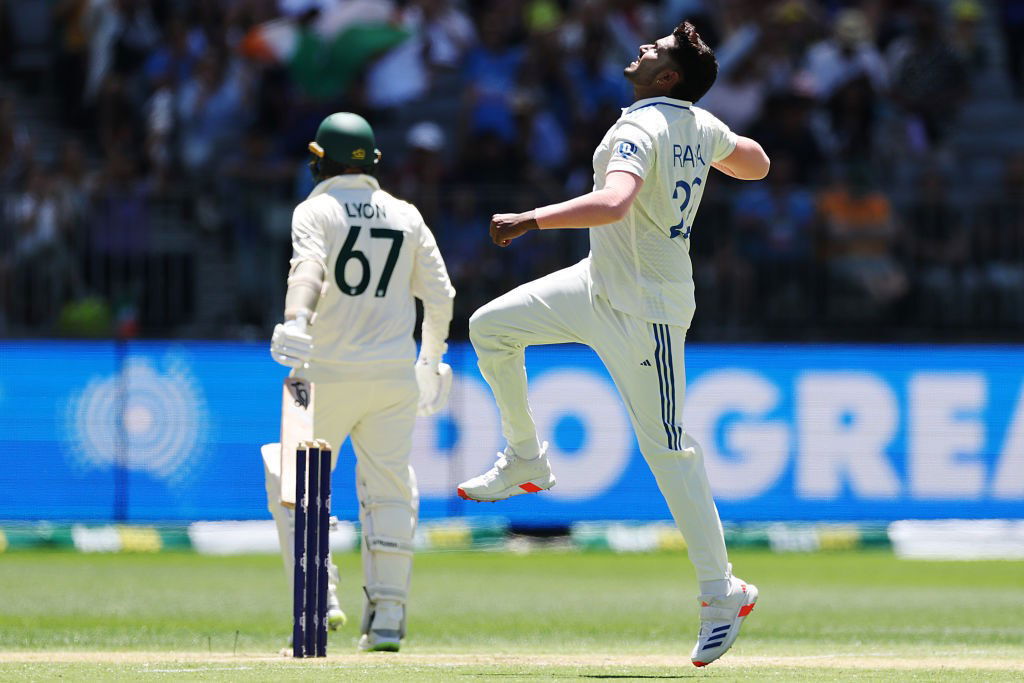 Harshit Rana jumps in celebration as Nathan lyon walks off.