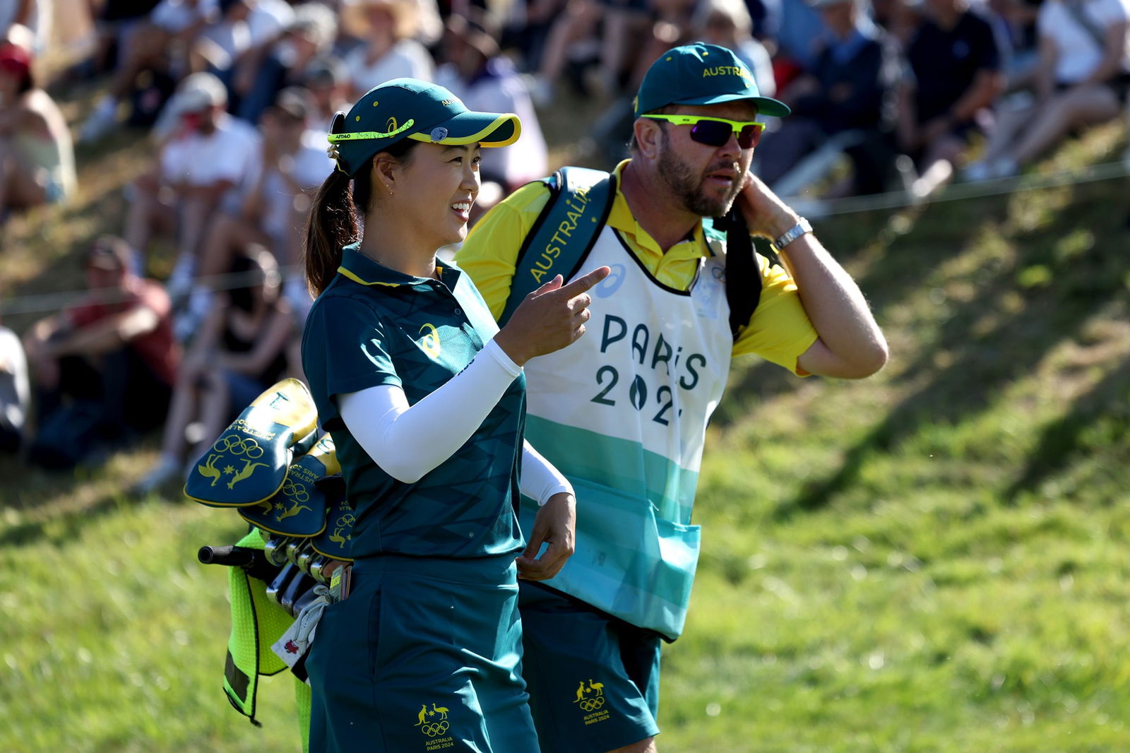 Minjee Lee of Team Australia looks on with her caddie on the first hole during Day Two of the Women's Individual Stroke Play on day thirteen of the Olympic Games Paris 2024