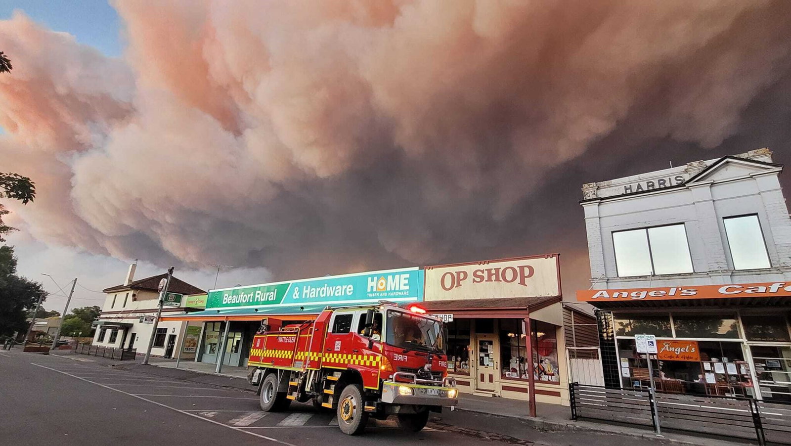 Smoke fills the sky over a Victorian town.