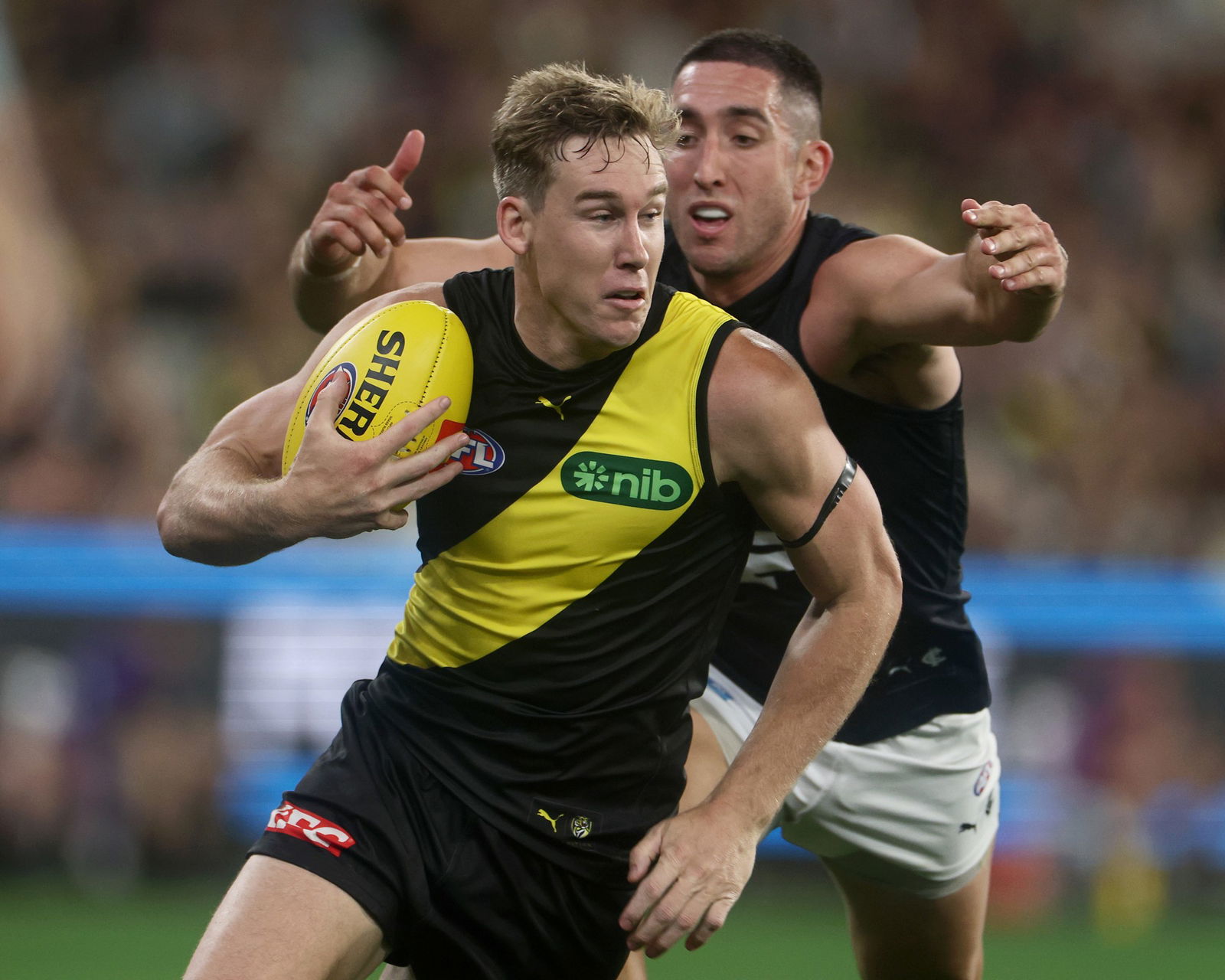 Tom Lynch runs the ball for the Tigers.