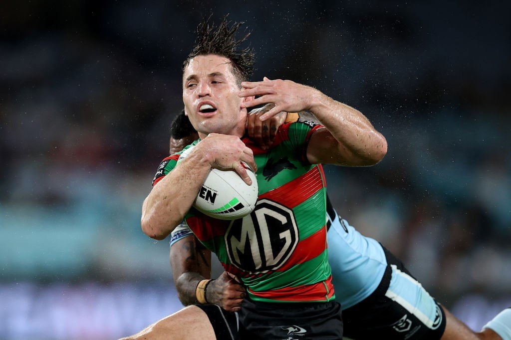 South Sydney player Cameron Murray is tackled by Cronulla Shark's Sione Katoa during an NRL game.