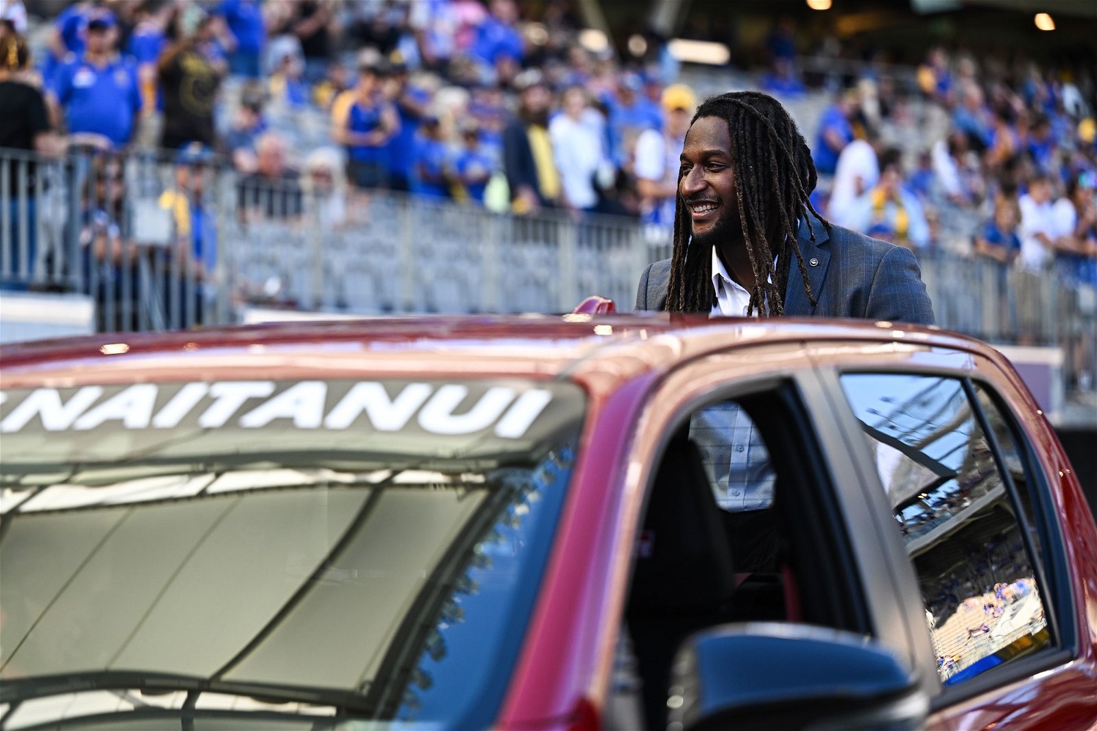 Former West Coast player Nic Naitanui does a lap of honour at Perth Stadium.