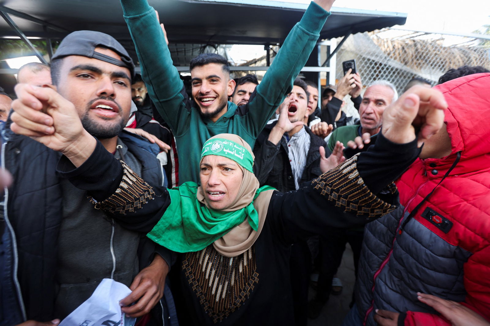 A group of Palestinians celebrating in a street