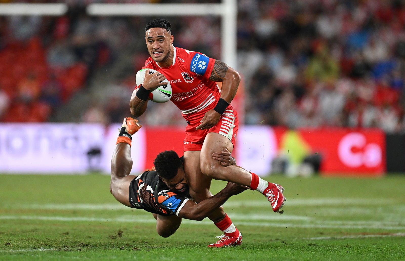 Valentine Holmes of the Dragons steps out of a tackle