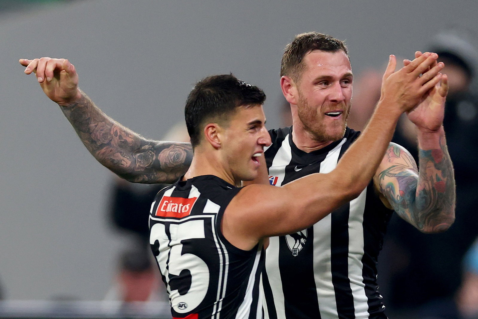 Tim Membrey of the Magpies is congratulated by Nick Daicos after kicking a goal during the round 19 AFL match between Collingwood Magpies and Carlton Blues at Melbourne Cricket Ground, on July 18, 2026, in Melbourne, Australia.