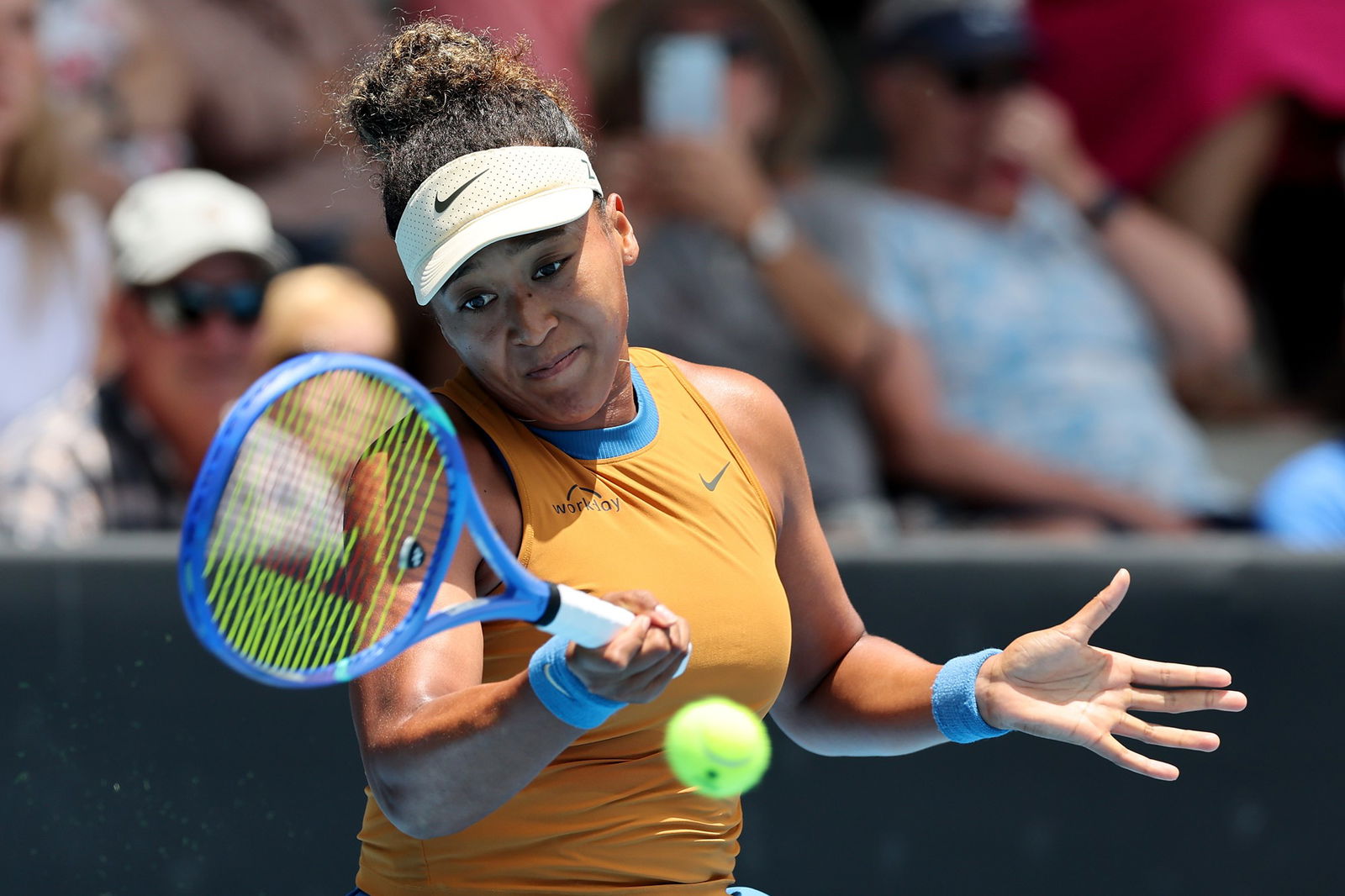 Naomi Osaka plays a forehand.