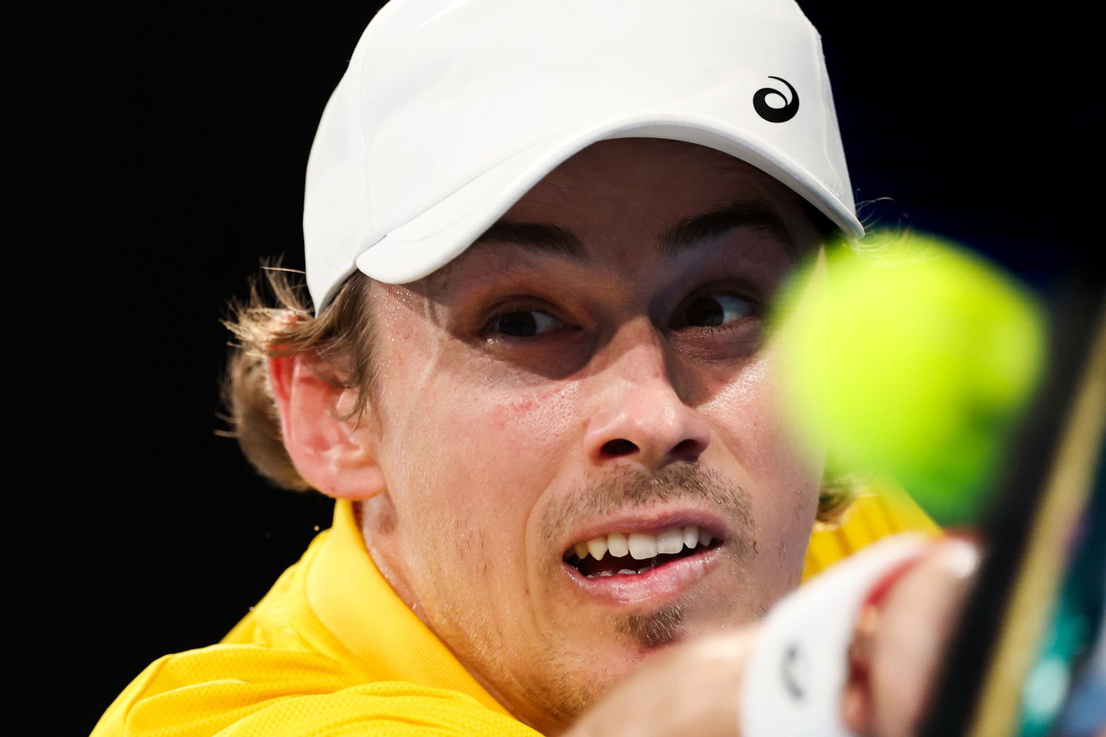 Alex de Minaur stretches for a backhand.