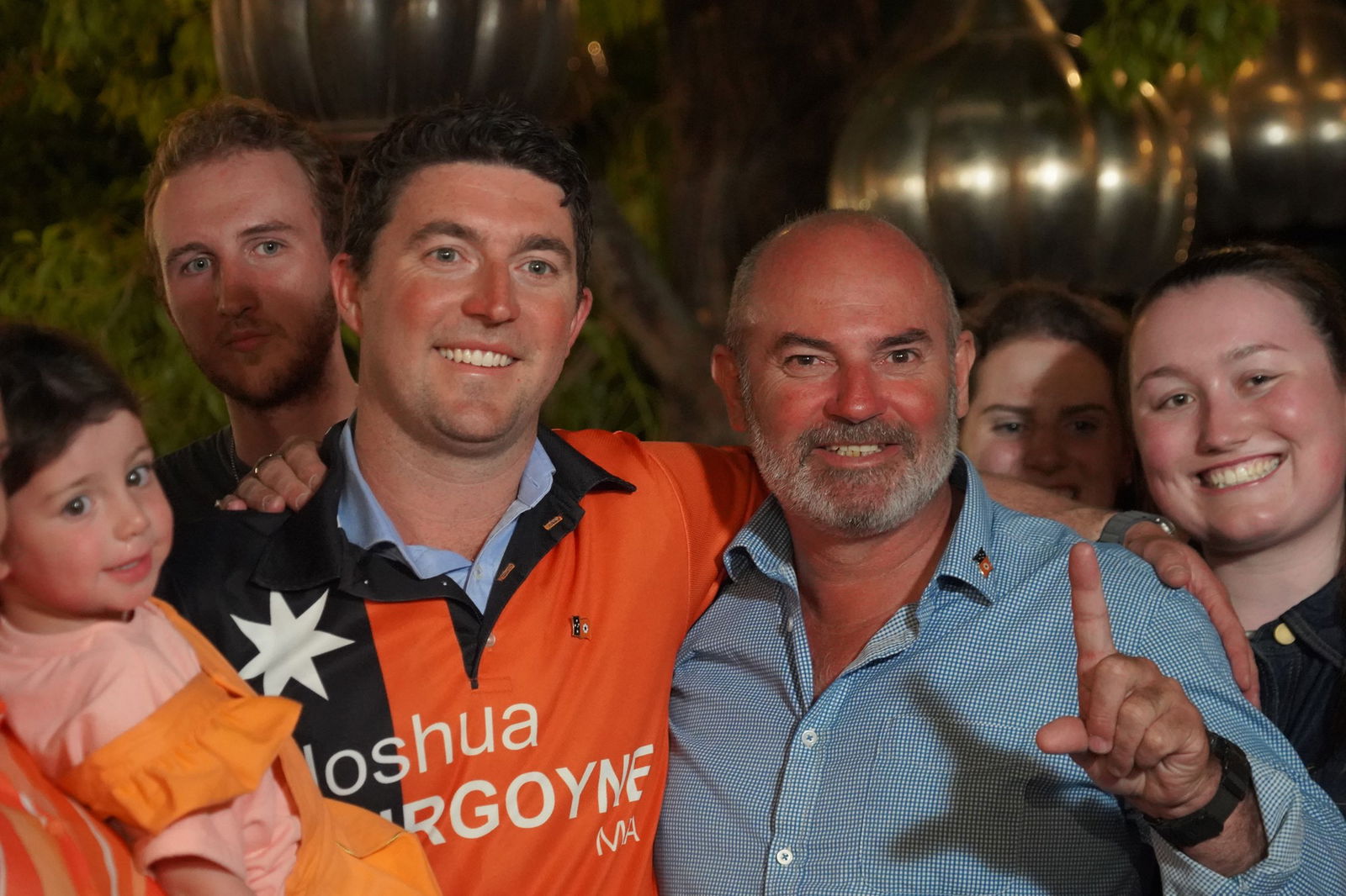 two male politicians smiling