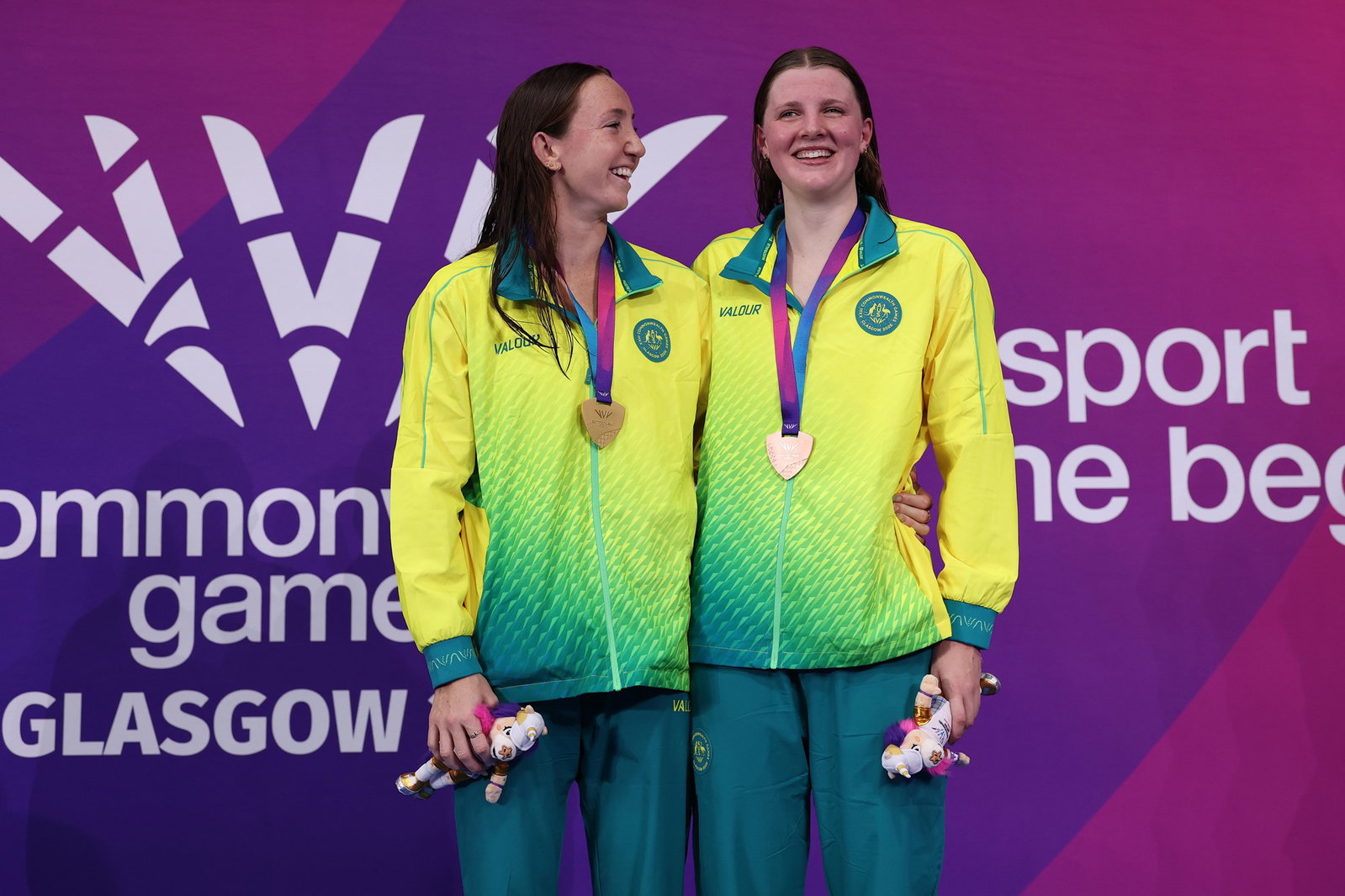 Lani Pallister and Molly Walker smiling on podium