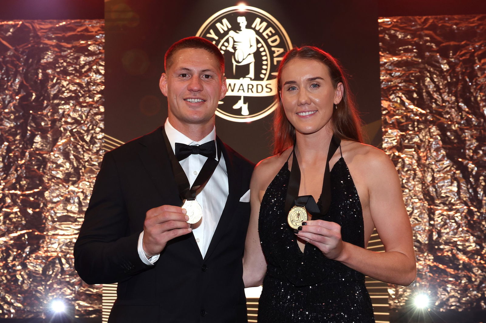 Kalyn Ponga and Tamika Upton pose with their Dally M Medals.