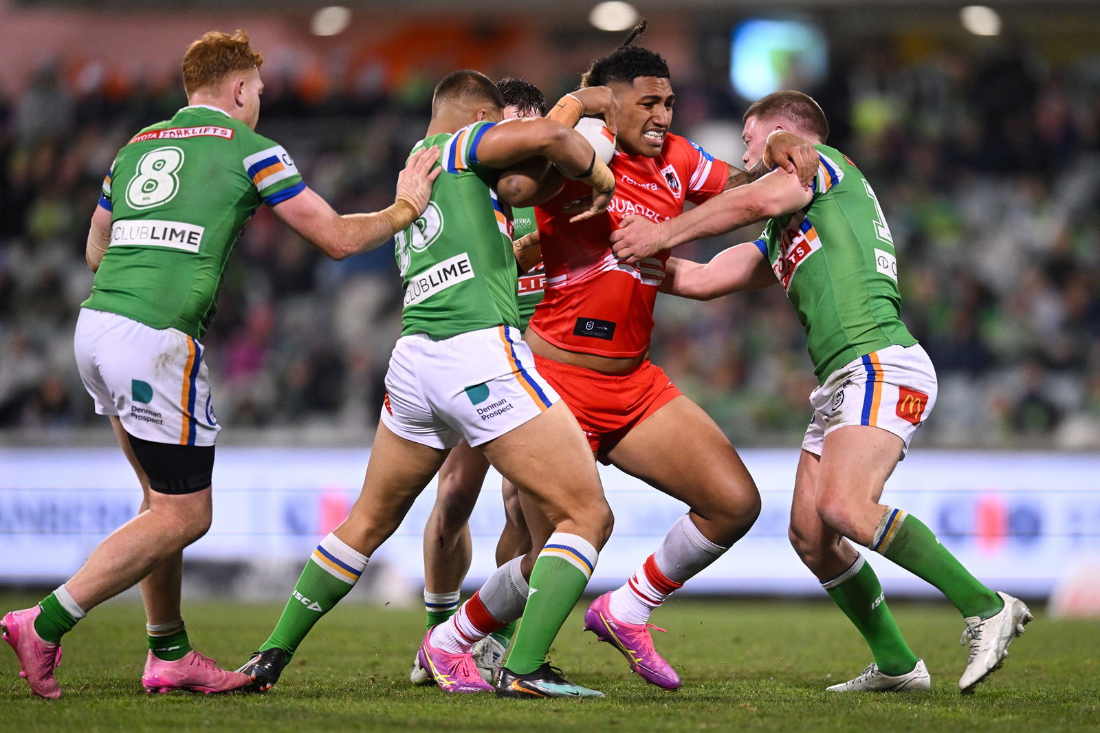 Loko Pasifiki Tonga running the ball, tackled by two players
