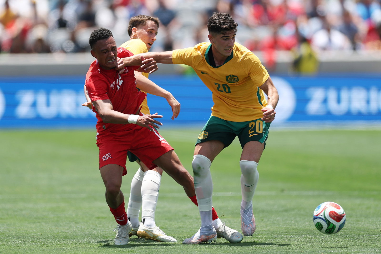 Cristian Volpato (right) struggled to get into the game in a poor first half performance by the Socceroos against Switzerland.