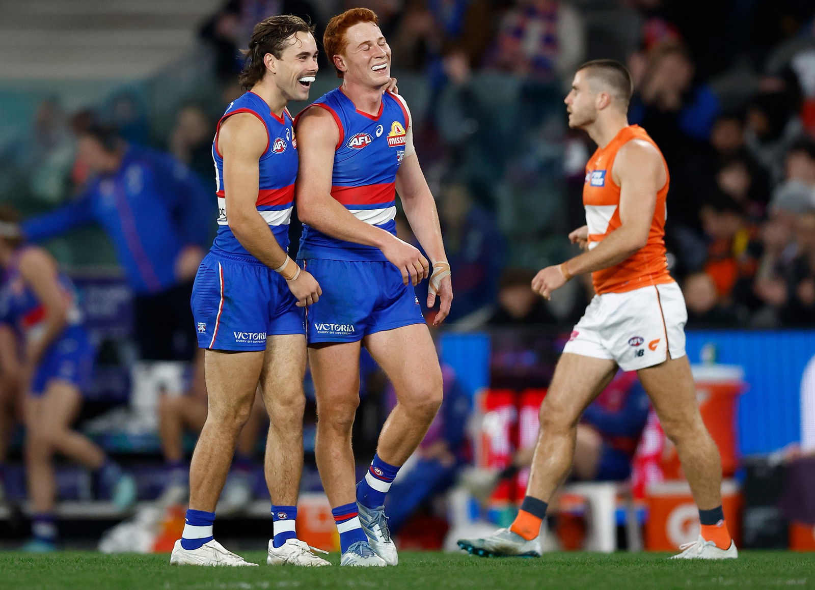 Lachlan McNeil (left) and Ed Richards of the Bulldogs celebrate during the 2025 AFL Round 21 match between the Western Bulldogs and the GWS Giants on July 31, 2025 in Melbourne, Australia.