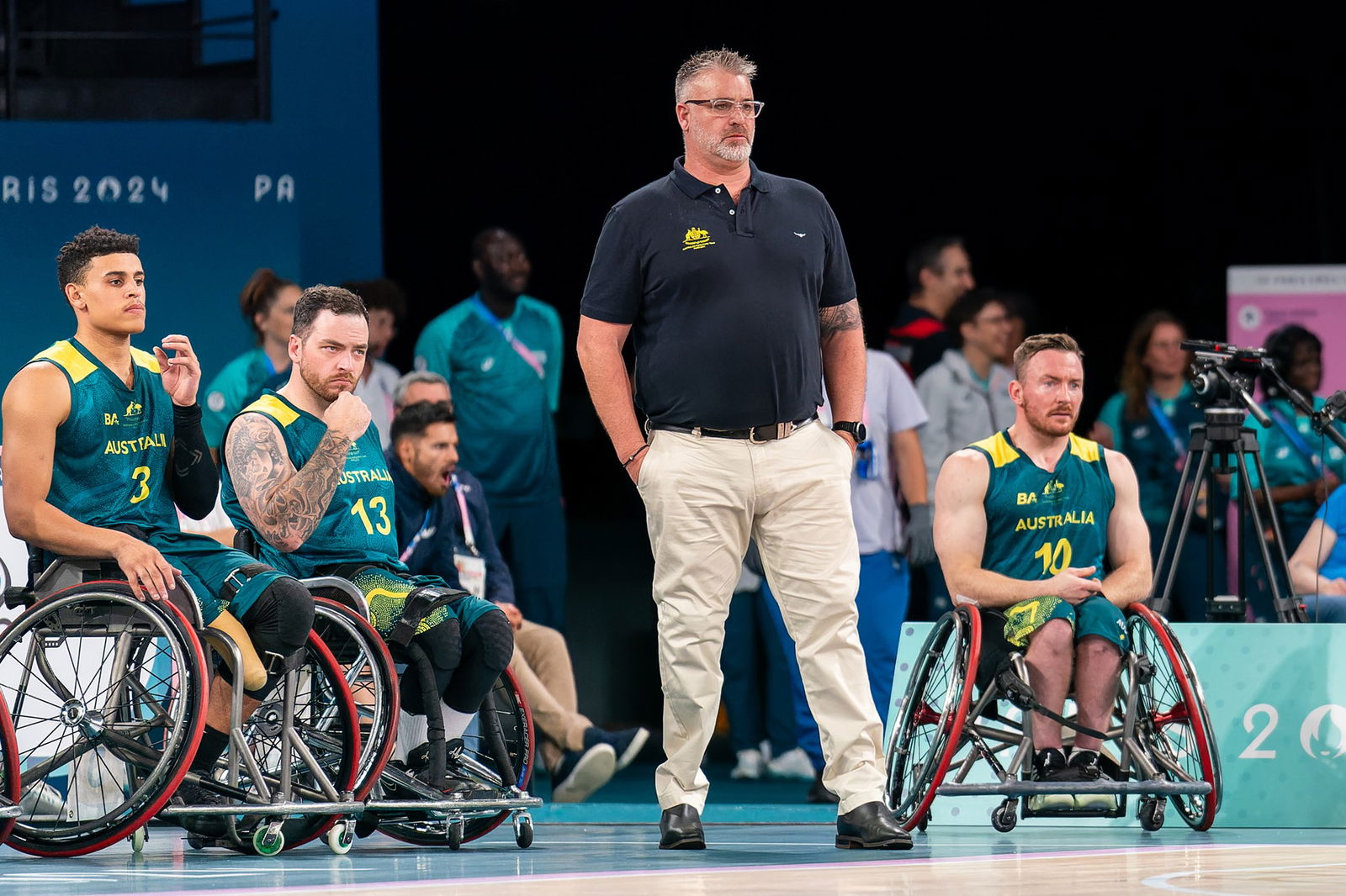 Australian men's wheelchair basketball coach Brad Ness watches during Australia's match against Netherlands. 