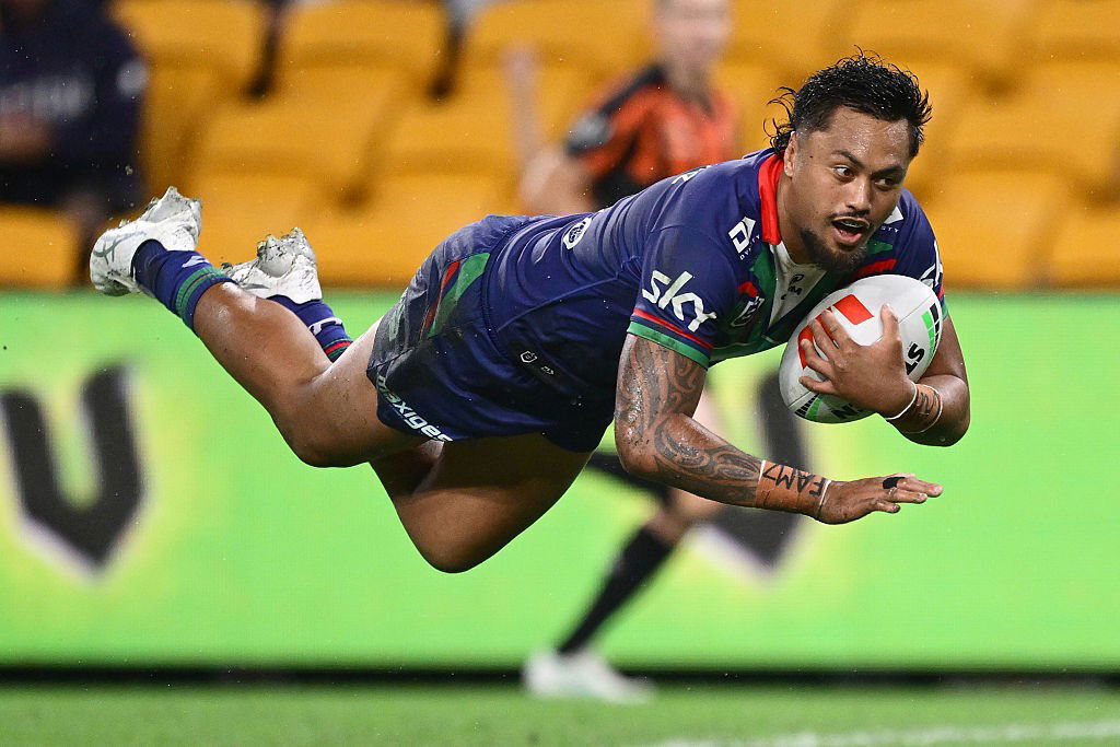 Adam Pompey dvies in for a try in an NRL game.