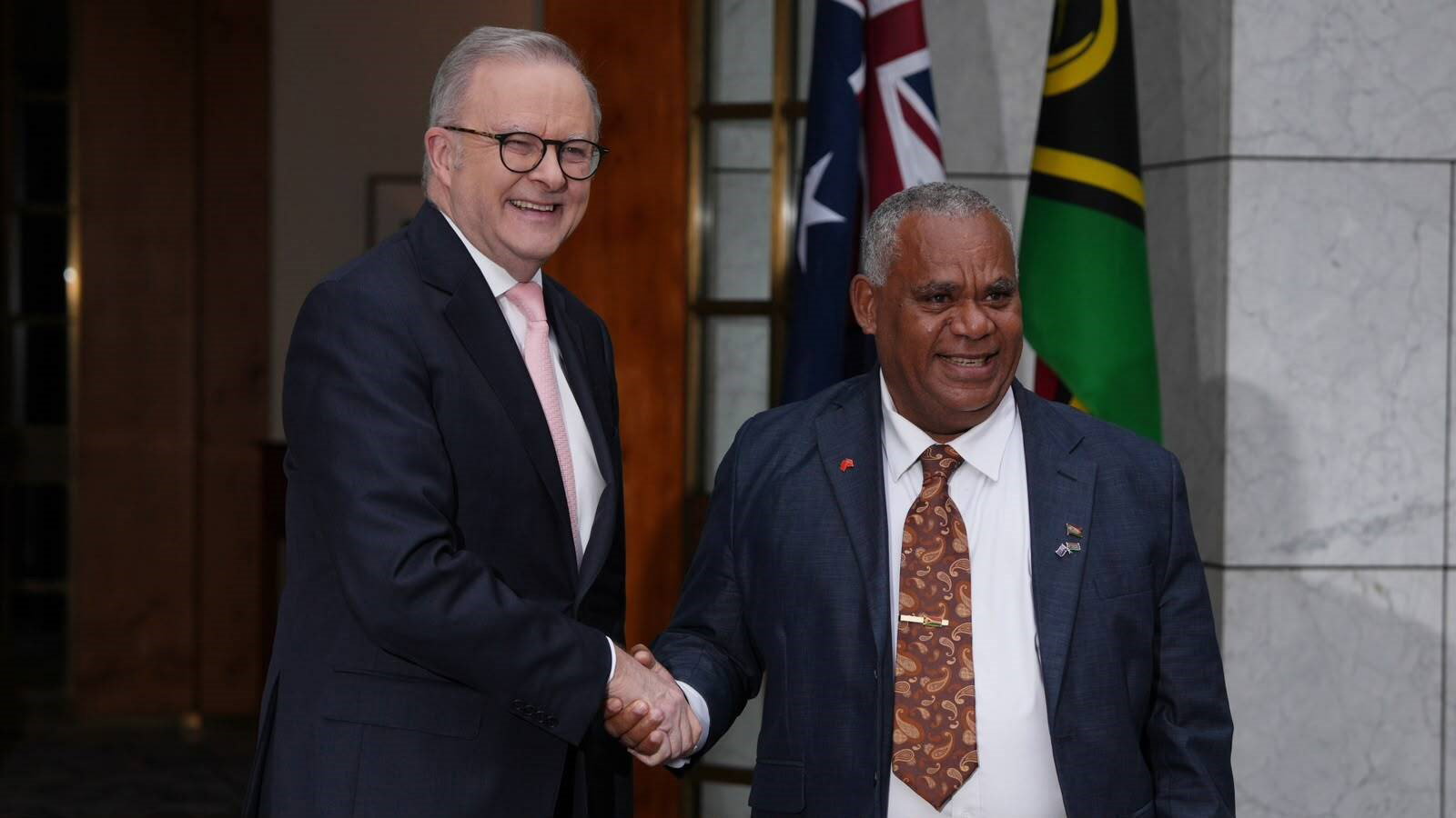 Albanese shakes hands with Jothan Napat.