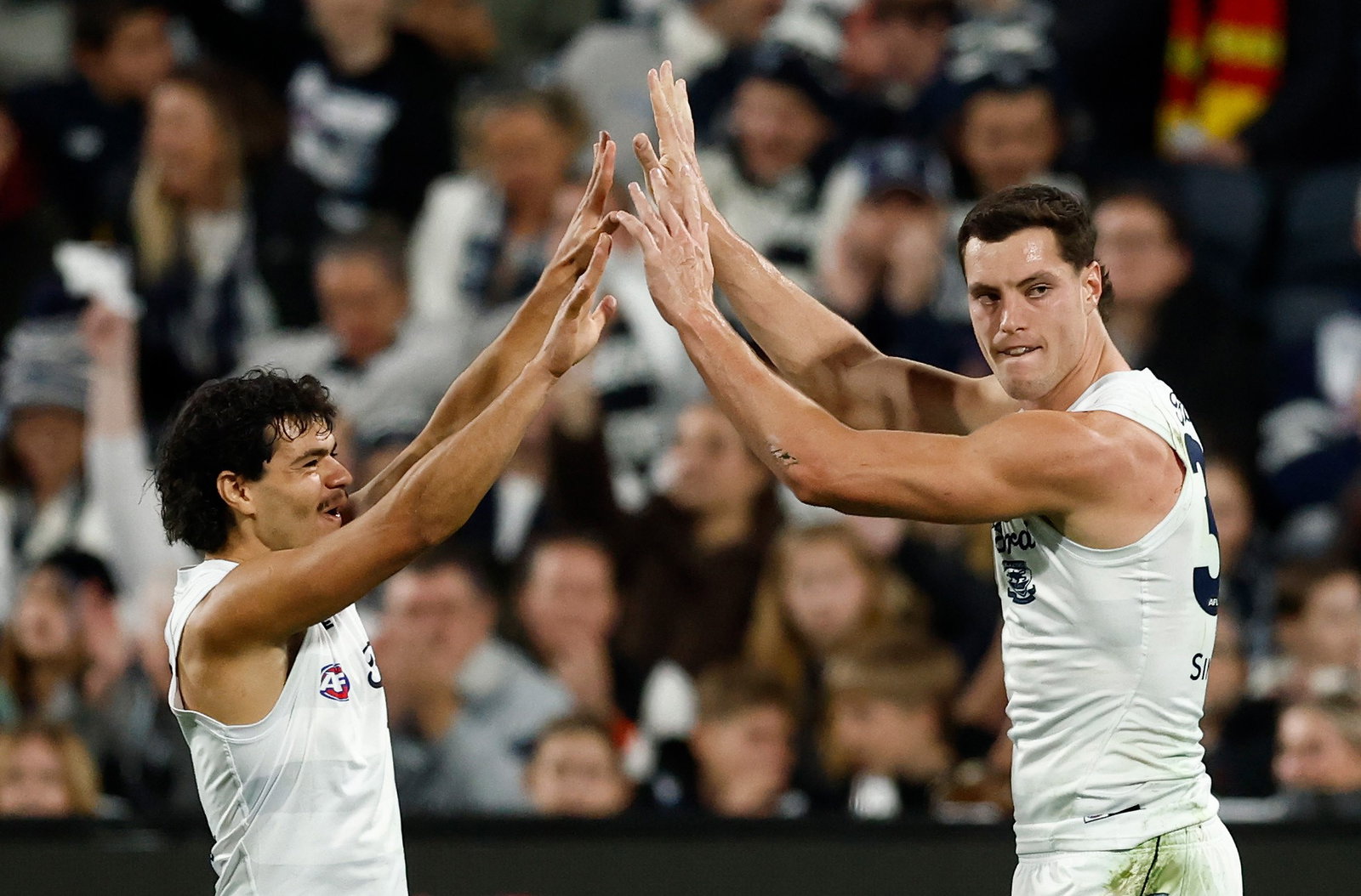 A long-range bomb from Shannon Neale (right) allowed Geelong to remain in control against Gold Coast.