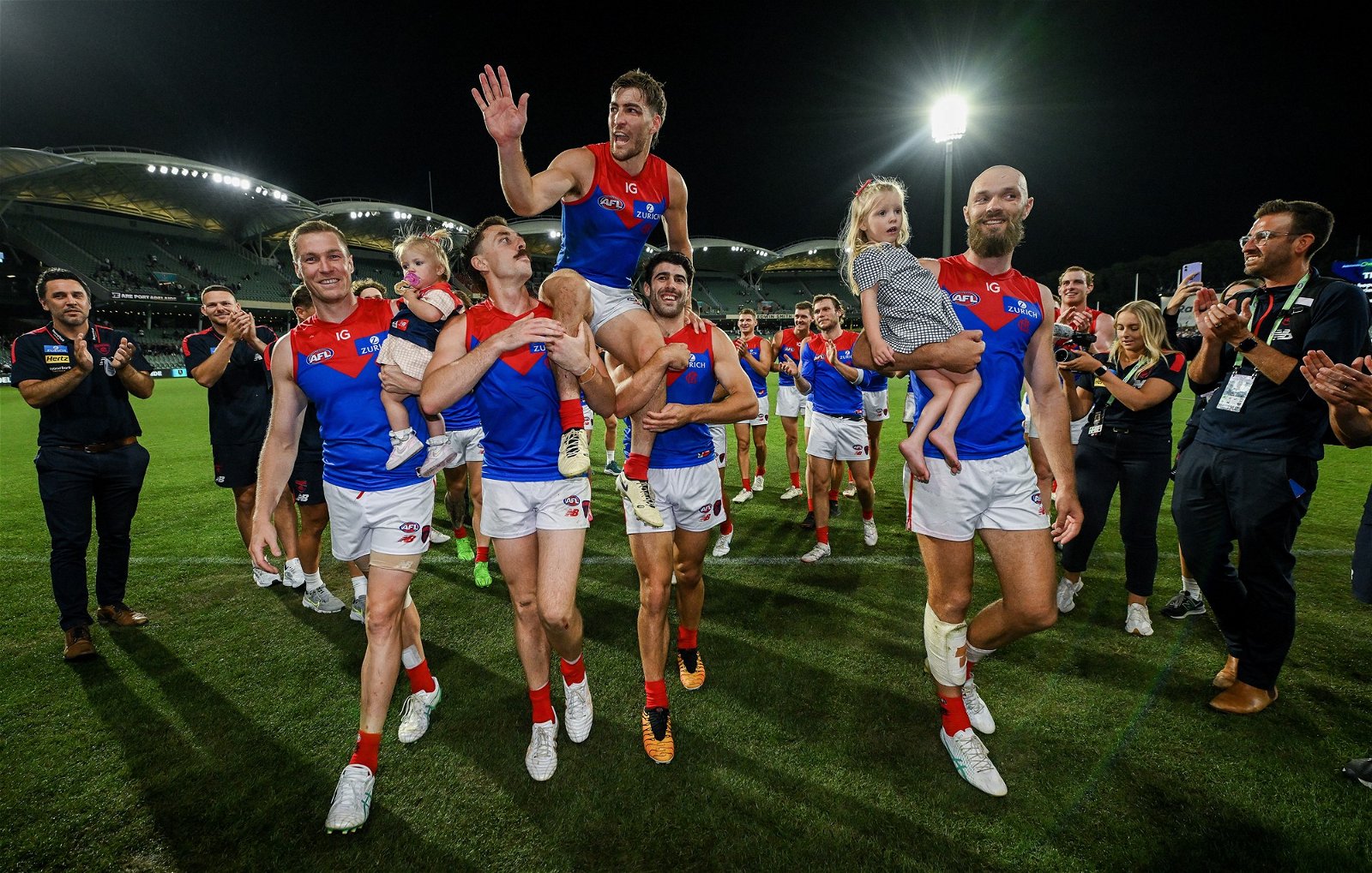 Melbourne players leave the field after a win
