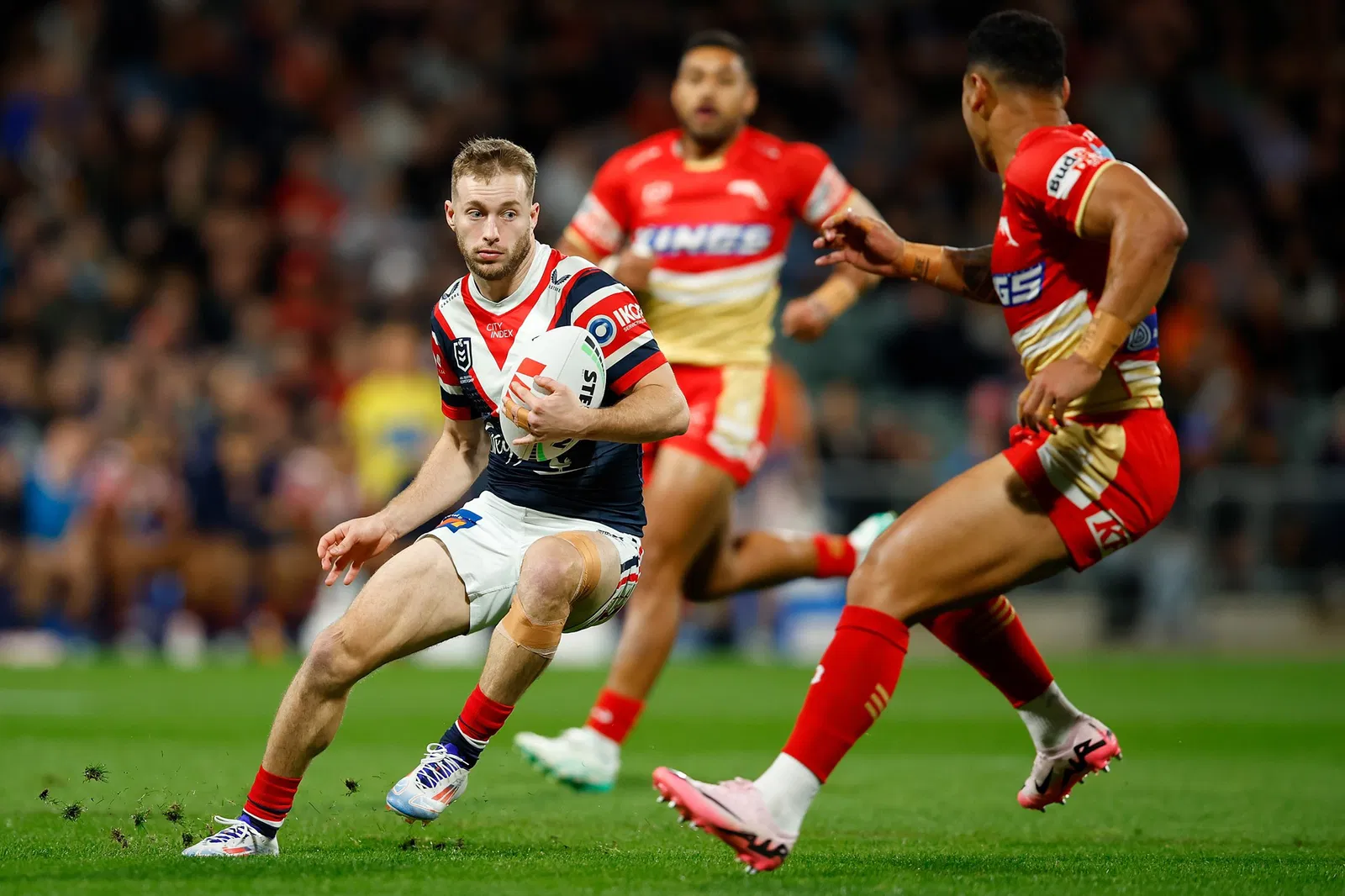 Sam Walker runs with the ball during a Sydney Roosters NRL game.