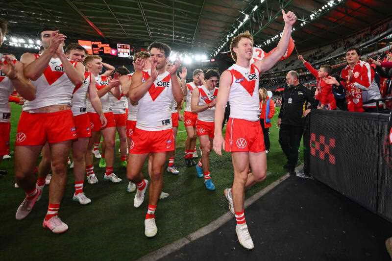 Sydney's Callum Mills celebrates after the Swans' win over Essendon at Docklands.