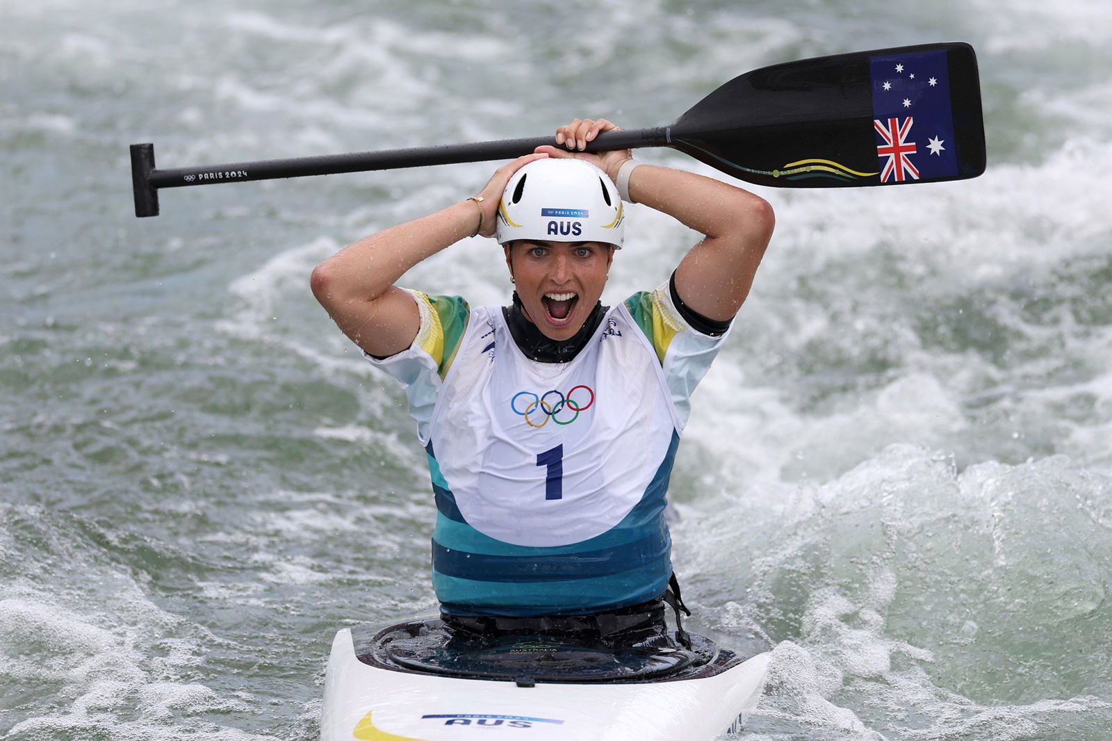 Jess Fox puts her hands on her head after winning the C1 canoe slalom at the Paris Olympics.
