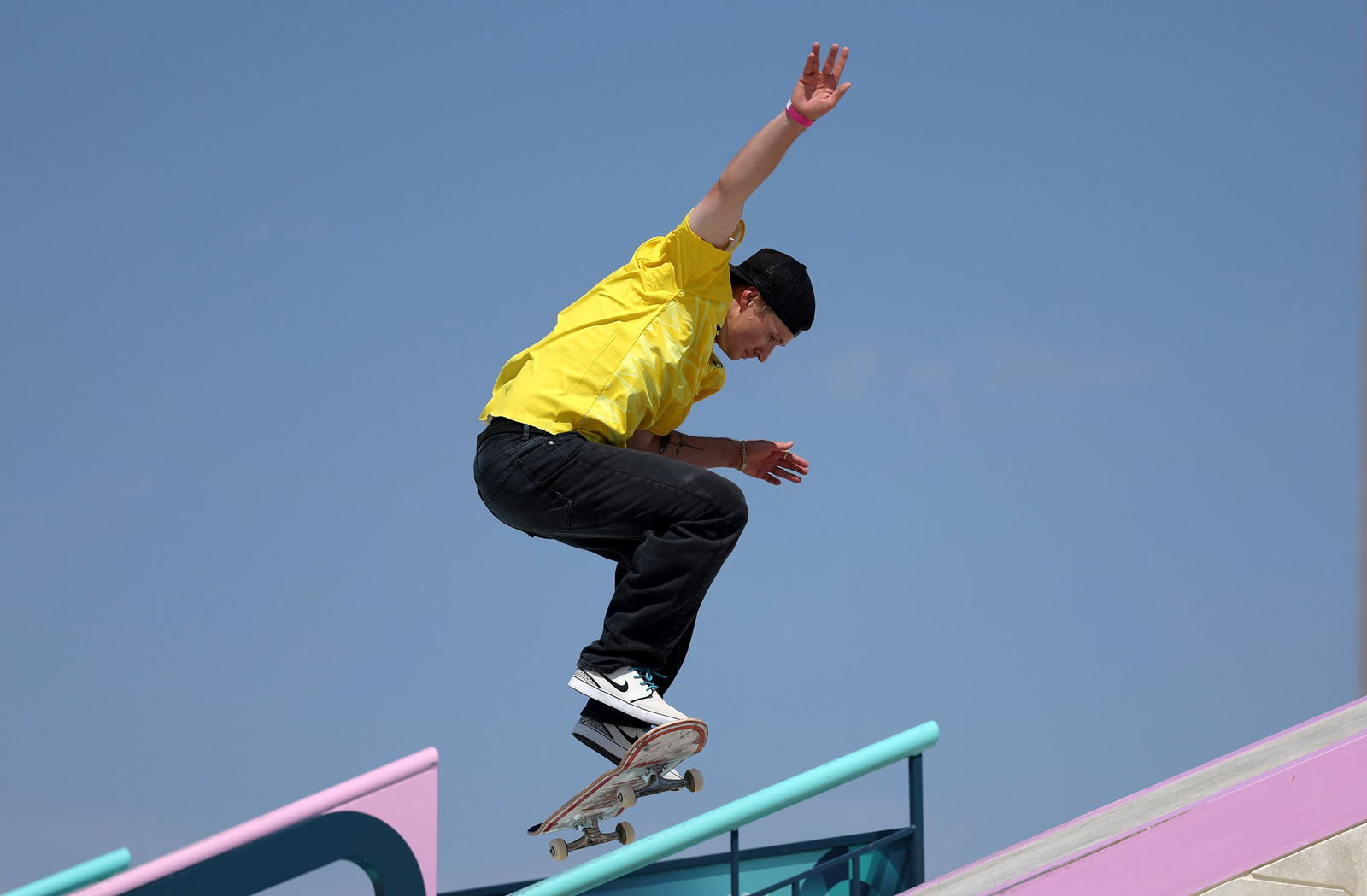 A skateboarder performs a trick.