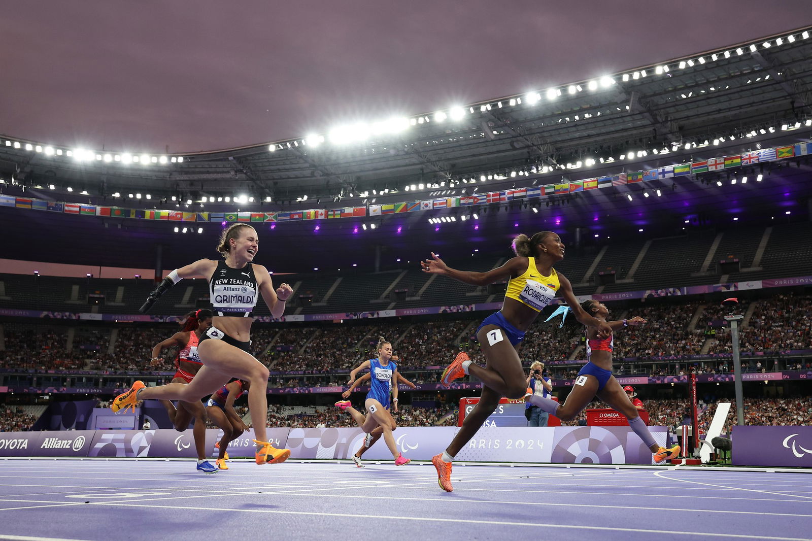 Ecuador's Kiara Rodriguez (C) reacts after winning gold in the women's 100m T47 final.