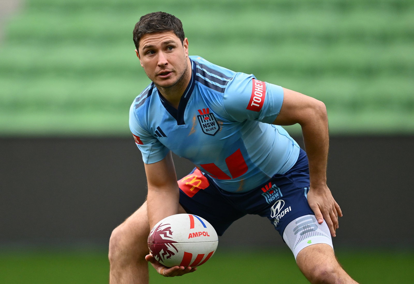 Mitchell Moses of the Blues prepares to pass the ball