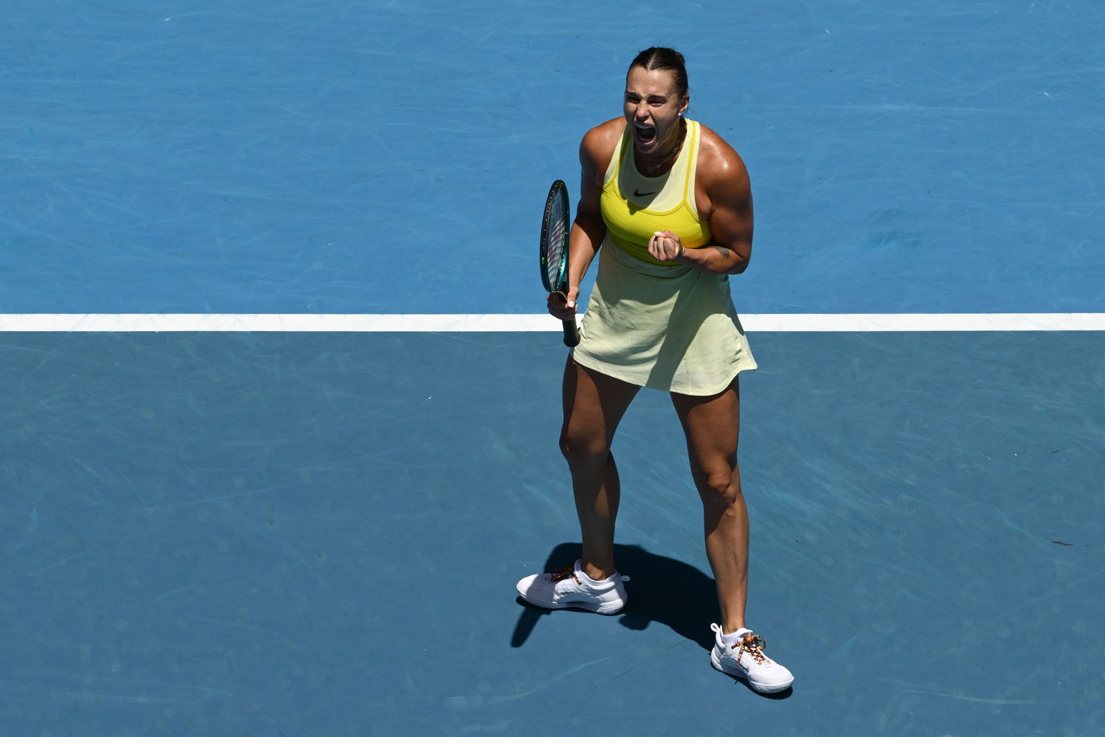 Aryna Sabalenka shouts in celebration at the Australian Open.