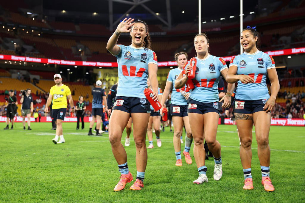 NSW Sky Blues players wave to fans after Women's State of Origin I.