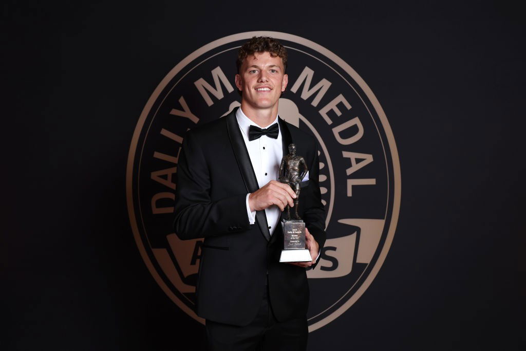 Jack Bostock with his statue for the NRL rookie of the year.