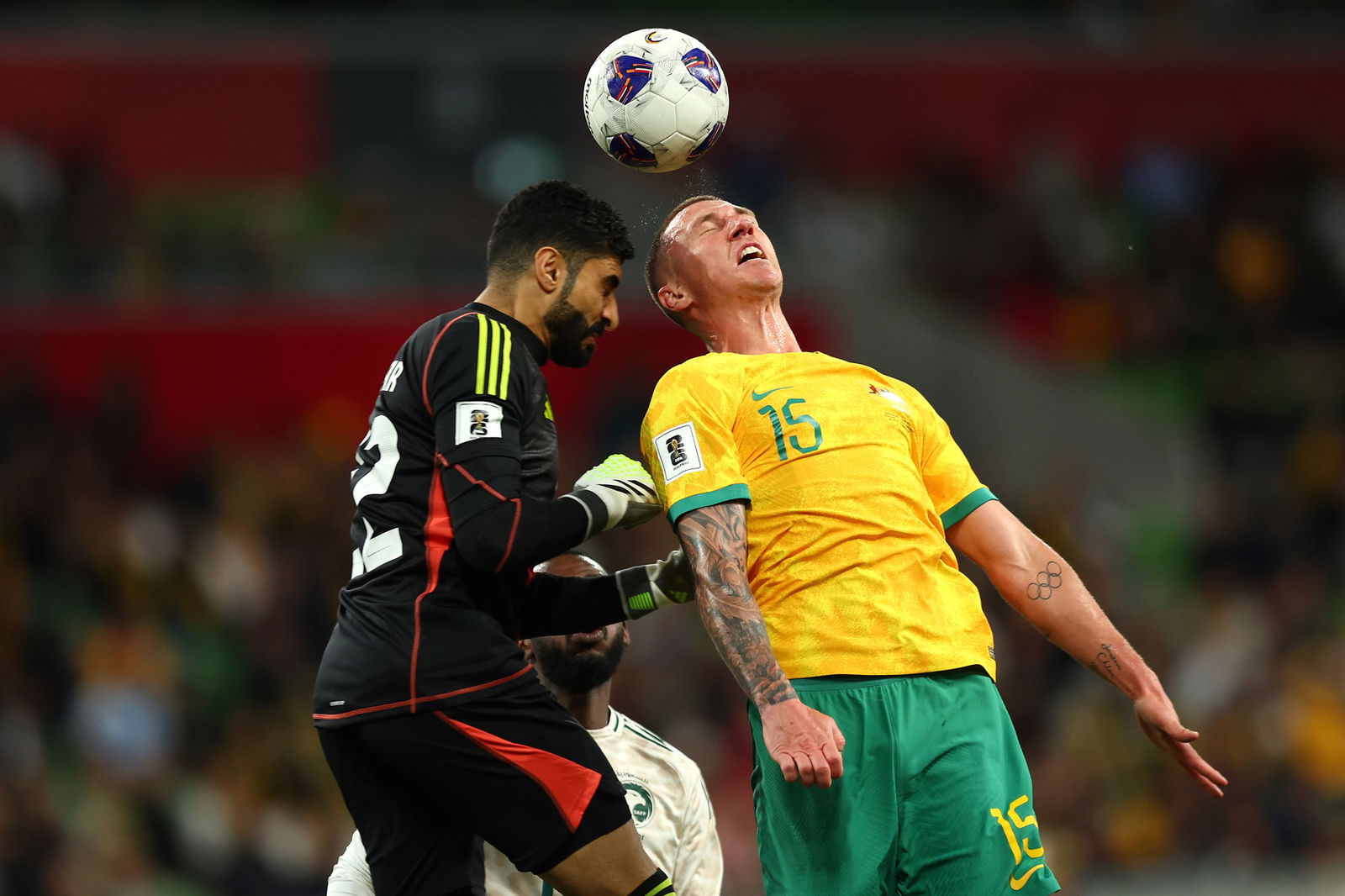 Mitch Duke and Ahmed Al-Kassar compete for the ball