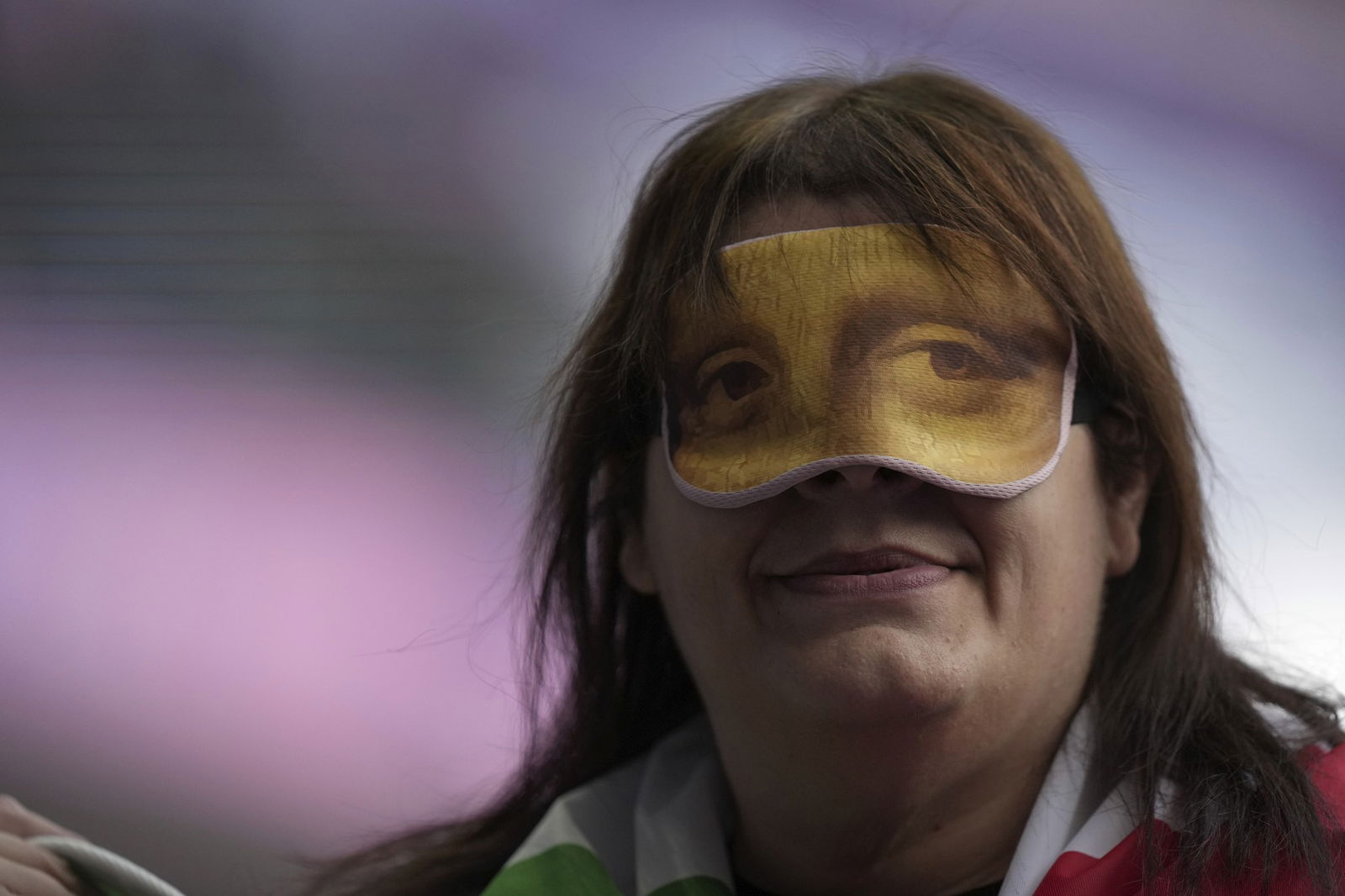 Assunia Legnante from Italy wears a Mona Lisa mask after winning the gold medal in the women's shot put F12 final.