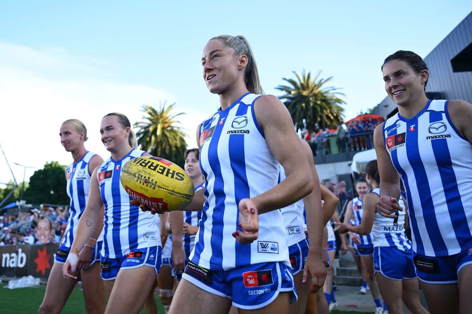 North Melbourne players enter the field