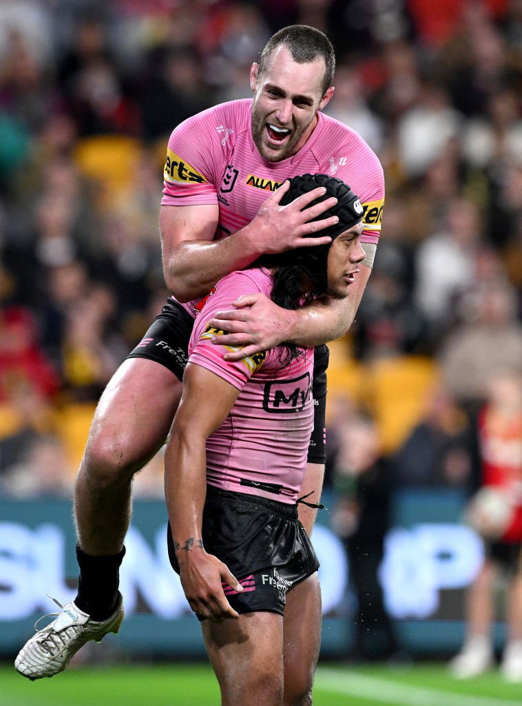 Isaah Yeo jumps on Jarome Luai during a Penrith Panthers NRL win.