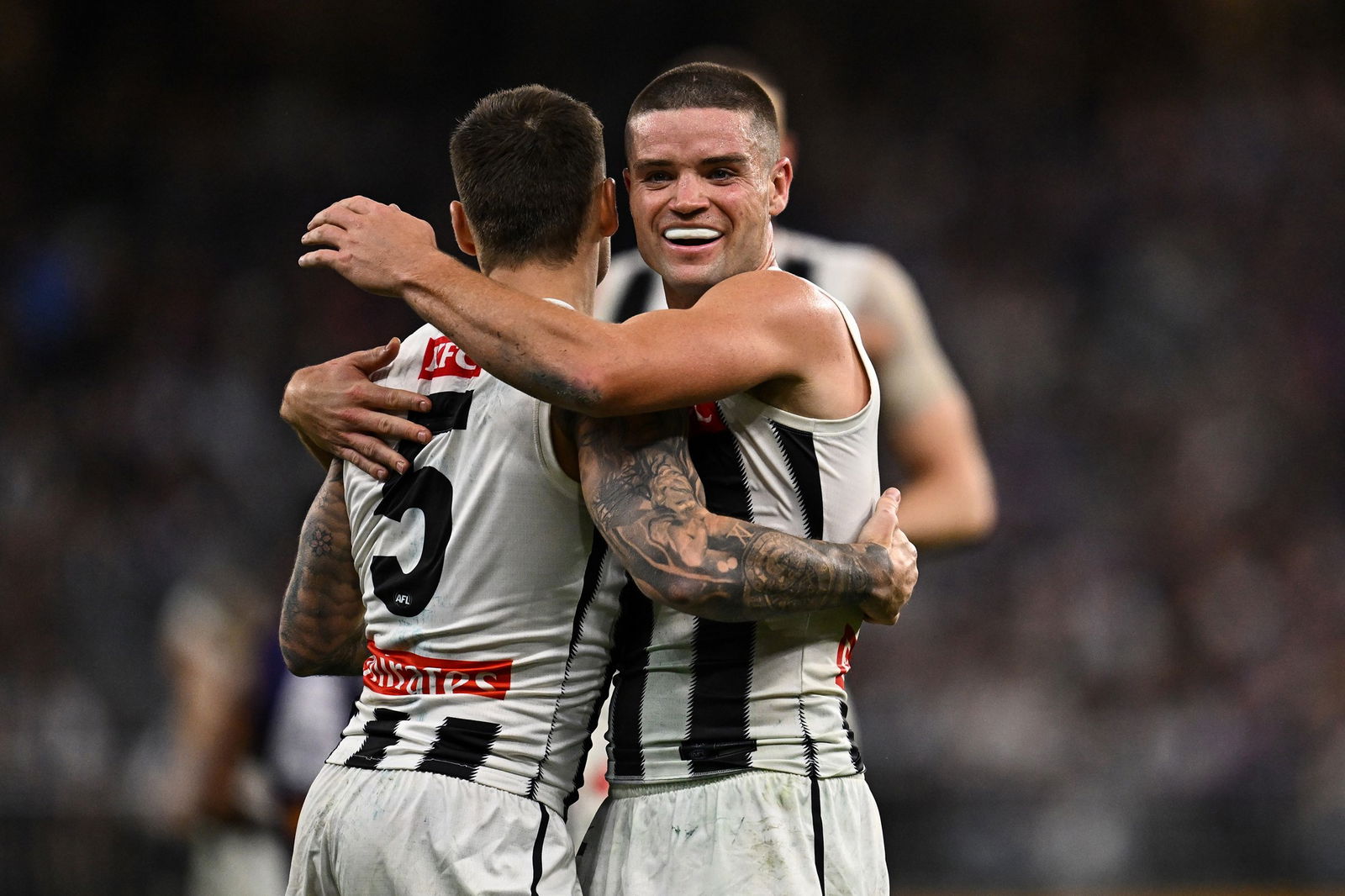Jamie Elliott celebrates one of his six goals in Collingwood's 14-point win over Fremantle in Perth.