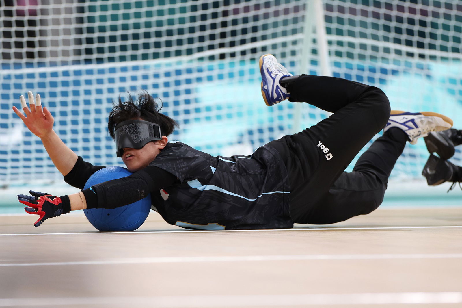 Japan's Saki Amuro makes a save during a goalball game against South Korea.