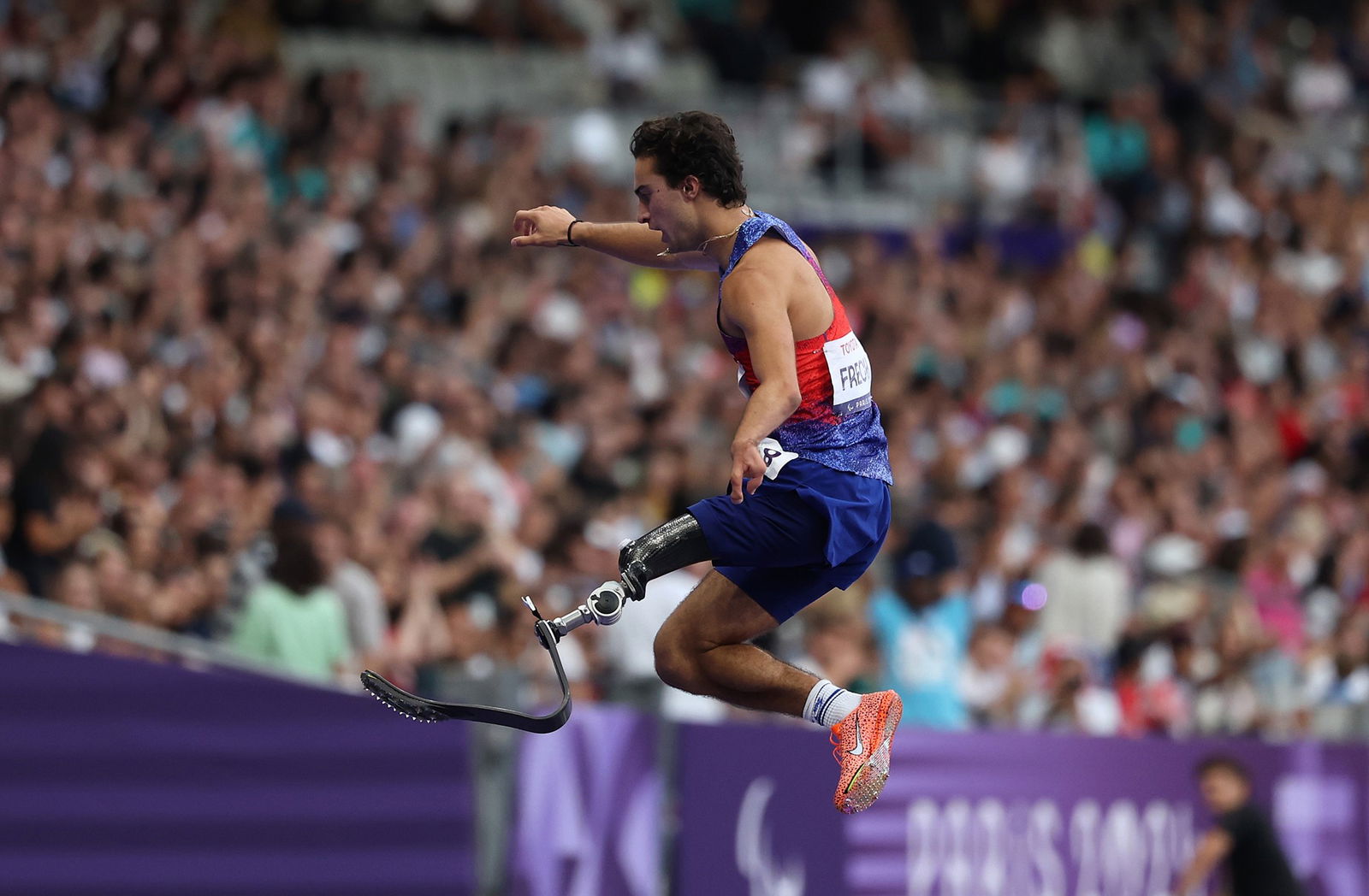 American Ezra Frech celebrates a gold medal in the men's 100m T63 final