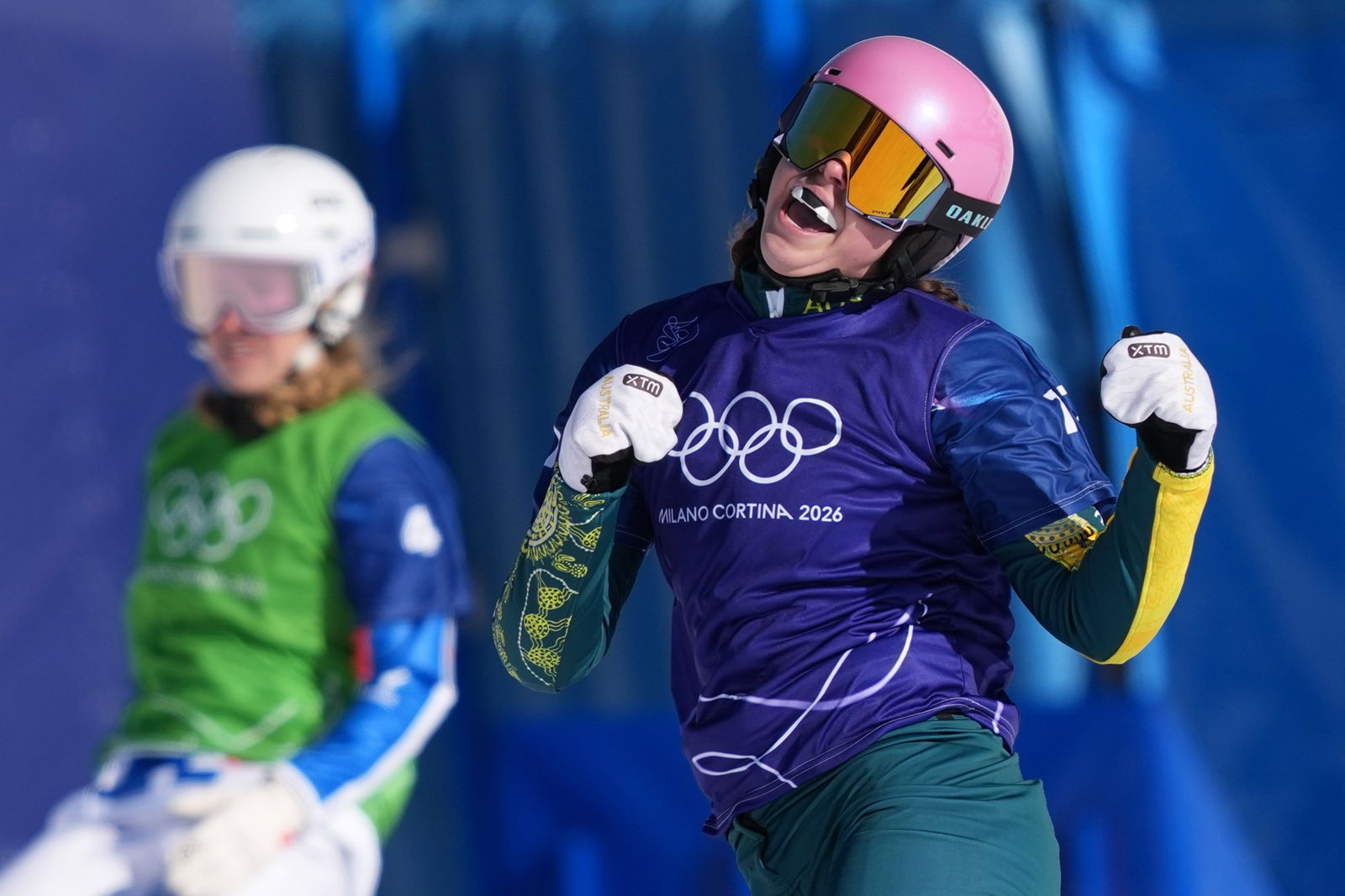 Josie Baff celebrates winning a race at Winter Olympics.