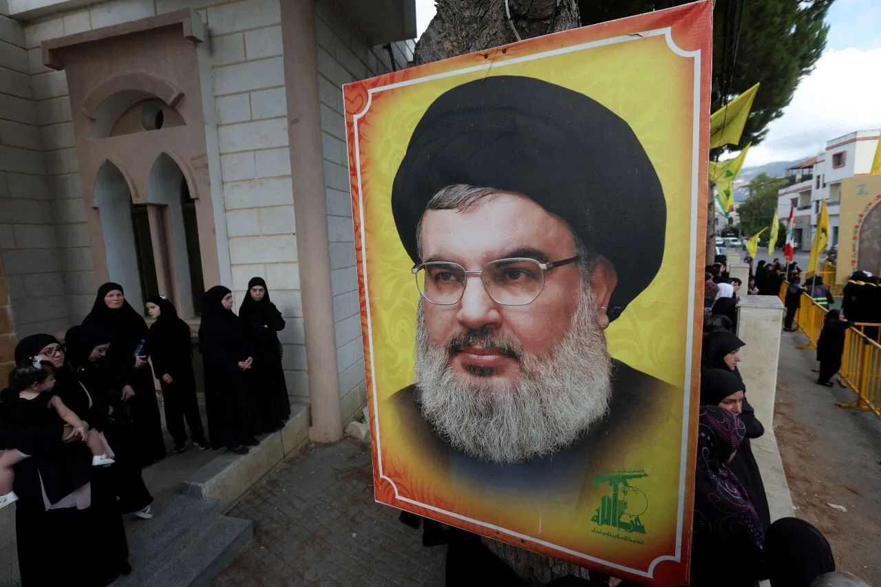 A poster of a man wearing religious clothing.