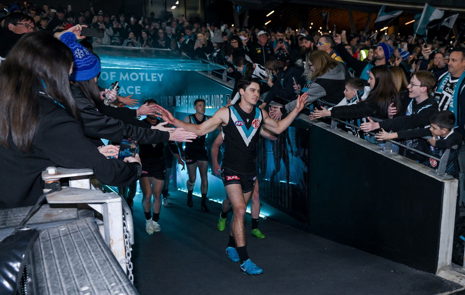 Connor Rozee leads Port Adelaide out ahead of the final against Hawthorn.