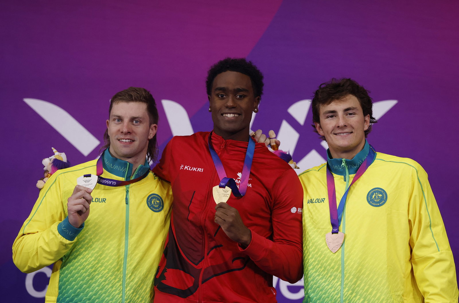 Matt Temple, Joshua Liendo and Ben Armbruster standing on the podium