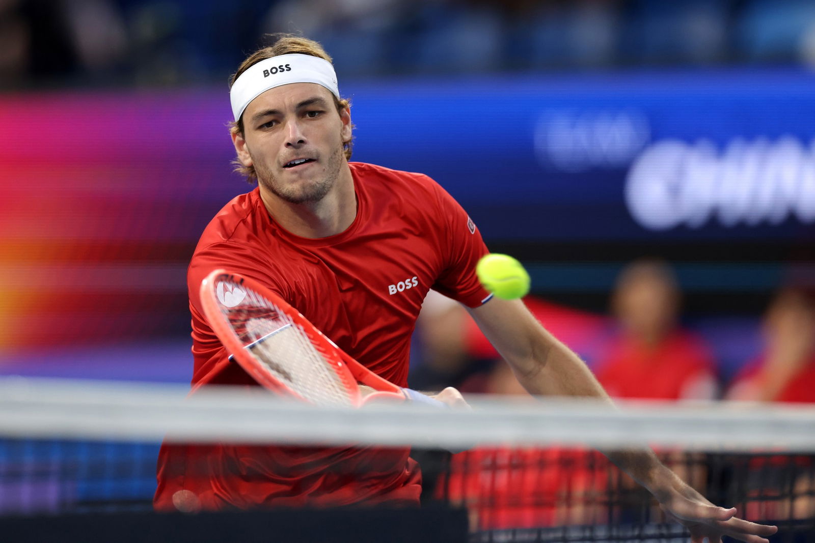 Taylor Fritz plays a forwhand volley.