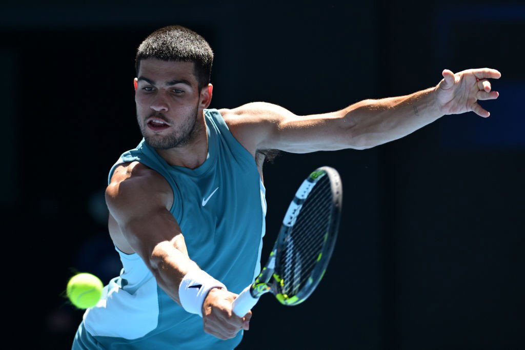 Carlos Alcaraz plays a backhand at the Australian Open.