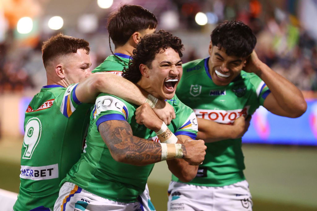 Xavier Savage shouts to celebrate a try with Canberra Raiders teammates.