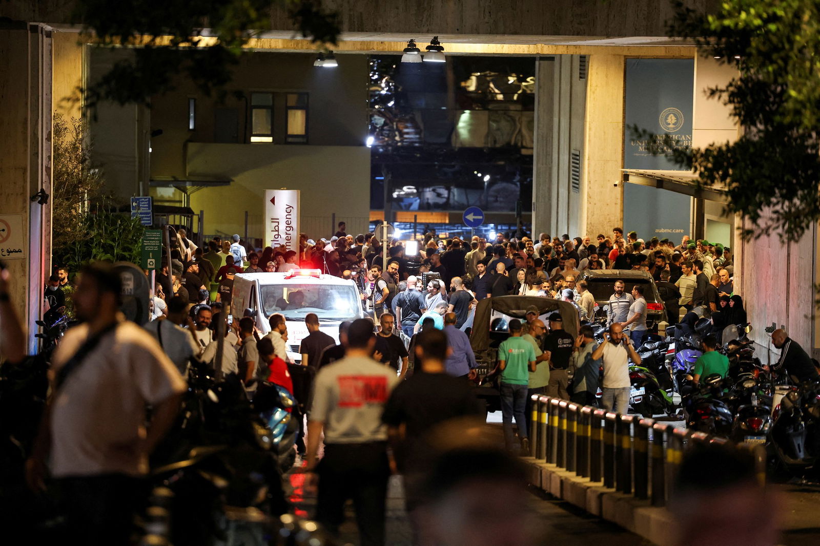 Crowds gather outside American University of Beirut Medical Centre.