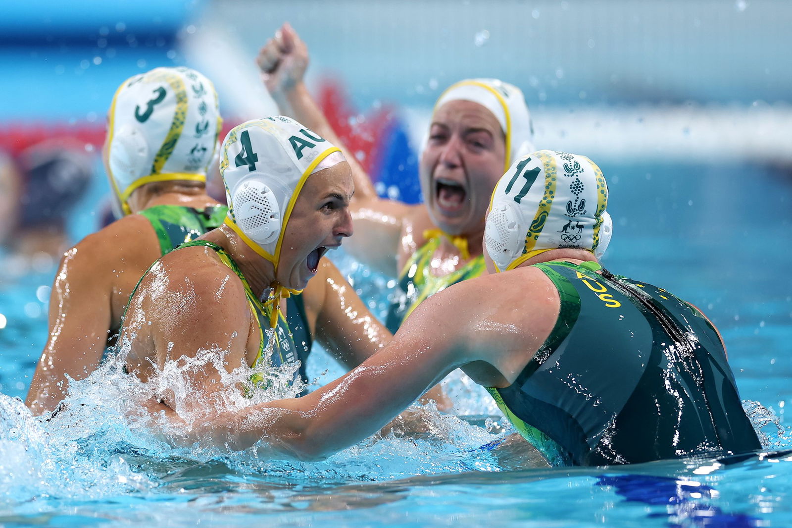 Australia's Bronte Halligan and Tillie Kearns celebrate theirwomen's water polo semifinal win over the United States.  