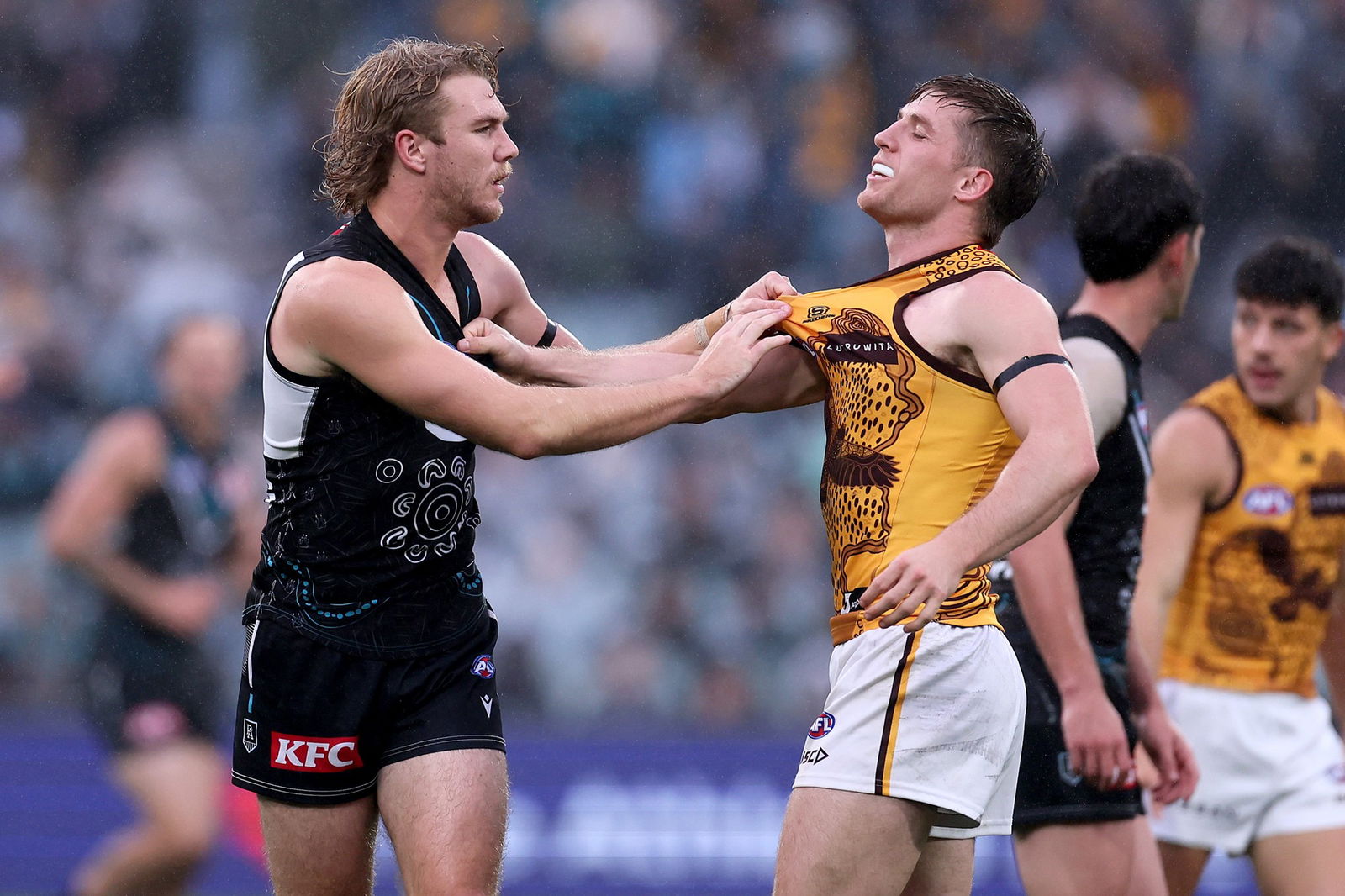 Jason Horne-Francis and Dylan Moore tussle during Port and Hawthorn's Round 10 clash.