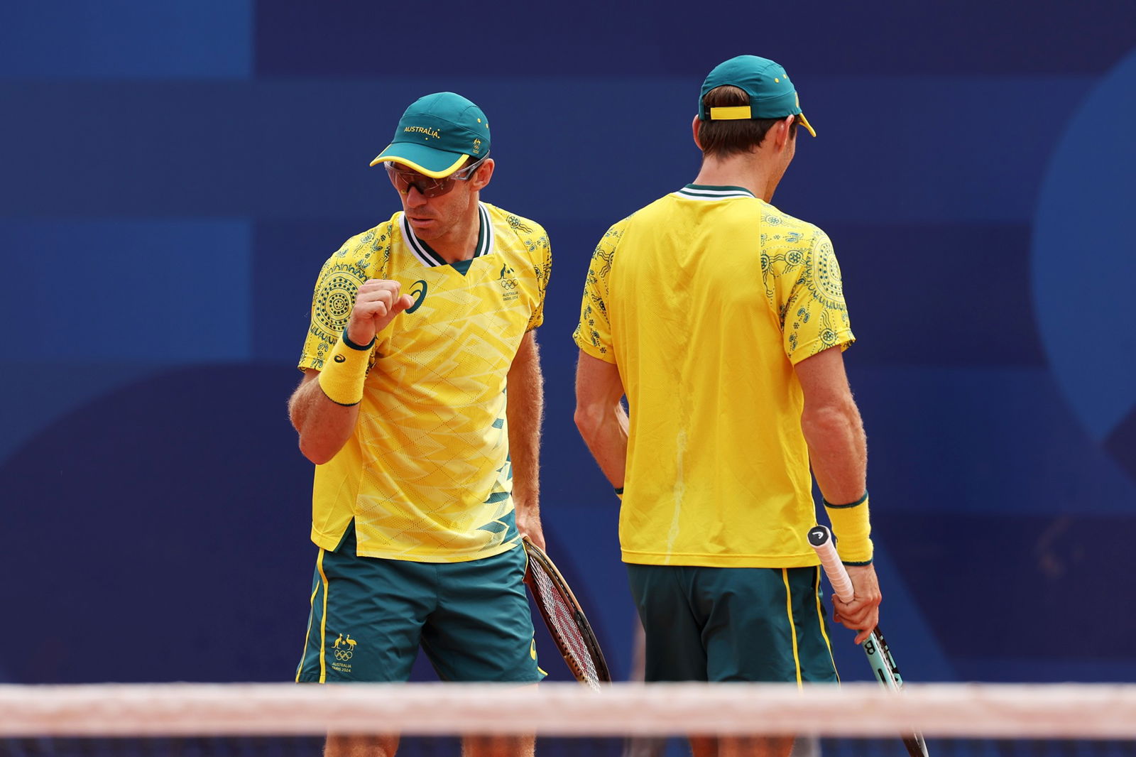 Australia's Matt Ebden (facing camera) and John Peers react during their men's doubles match at the Paris Olympics.