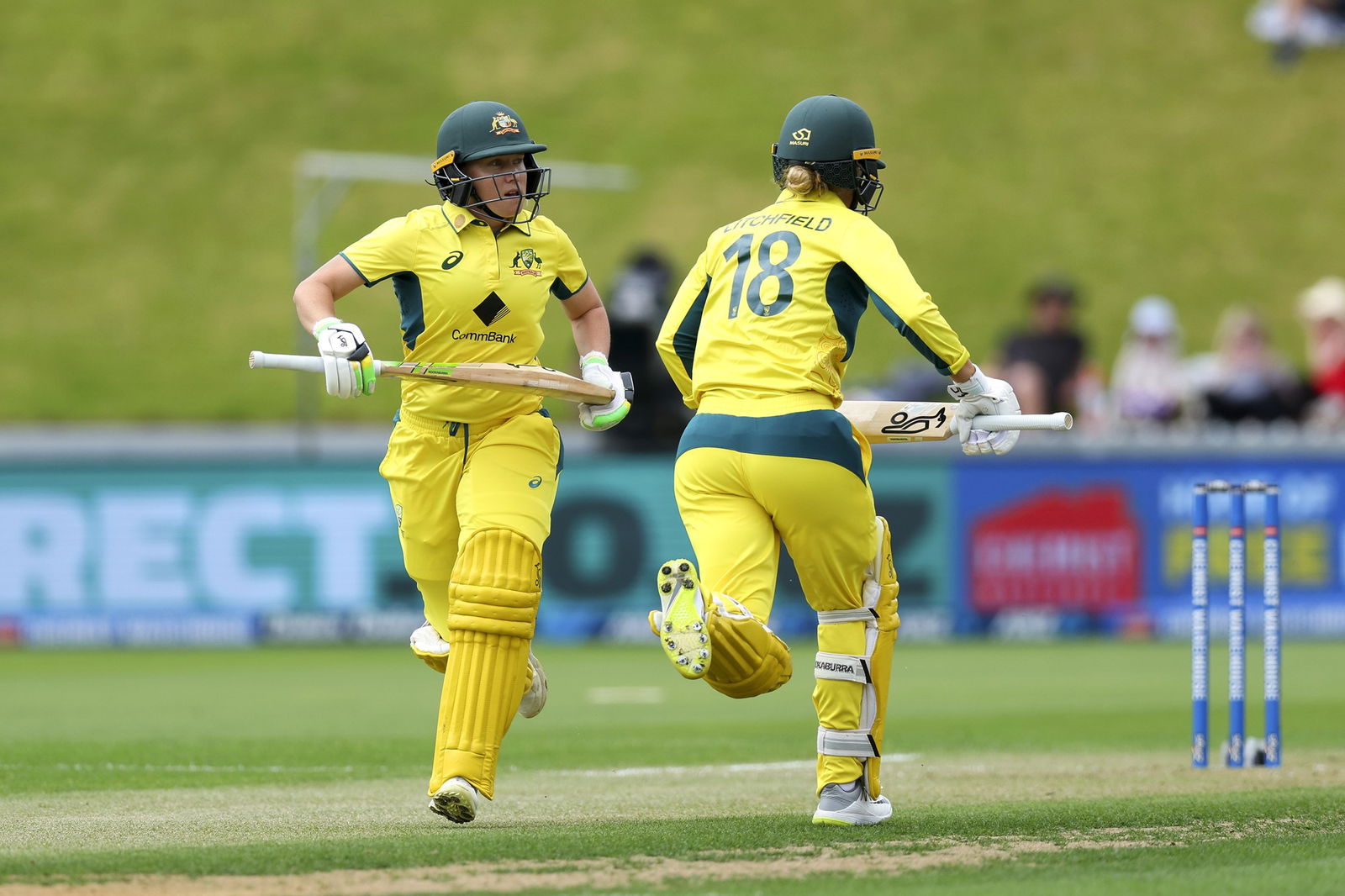 Alyssa Healy and Phoebe Litchfield running between the wickets during a match